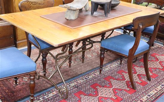 An extending conservatory table, with slatted cherrywood top over a Spanish style wrought iron base 260cm extended (2 spare leaves)